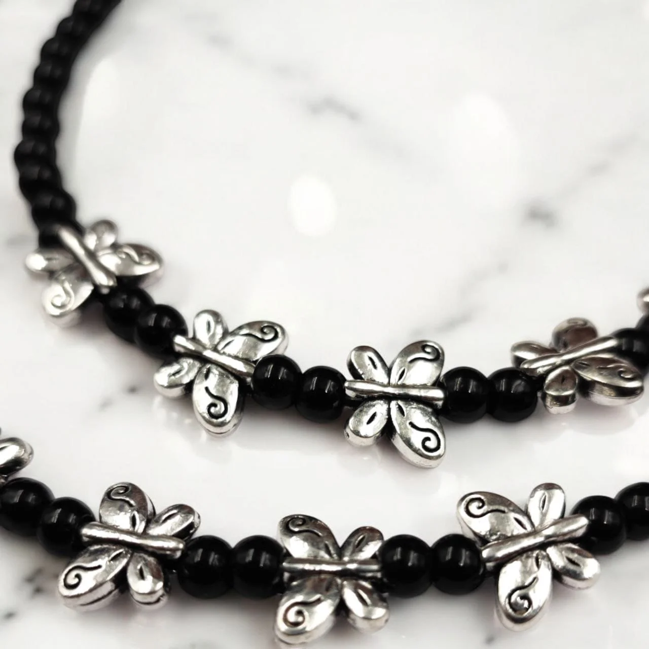 Oxidised Butterfly Charm Black Bead Anklets, Pair – view 2