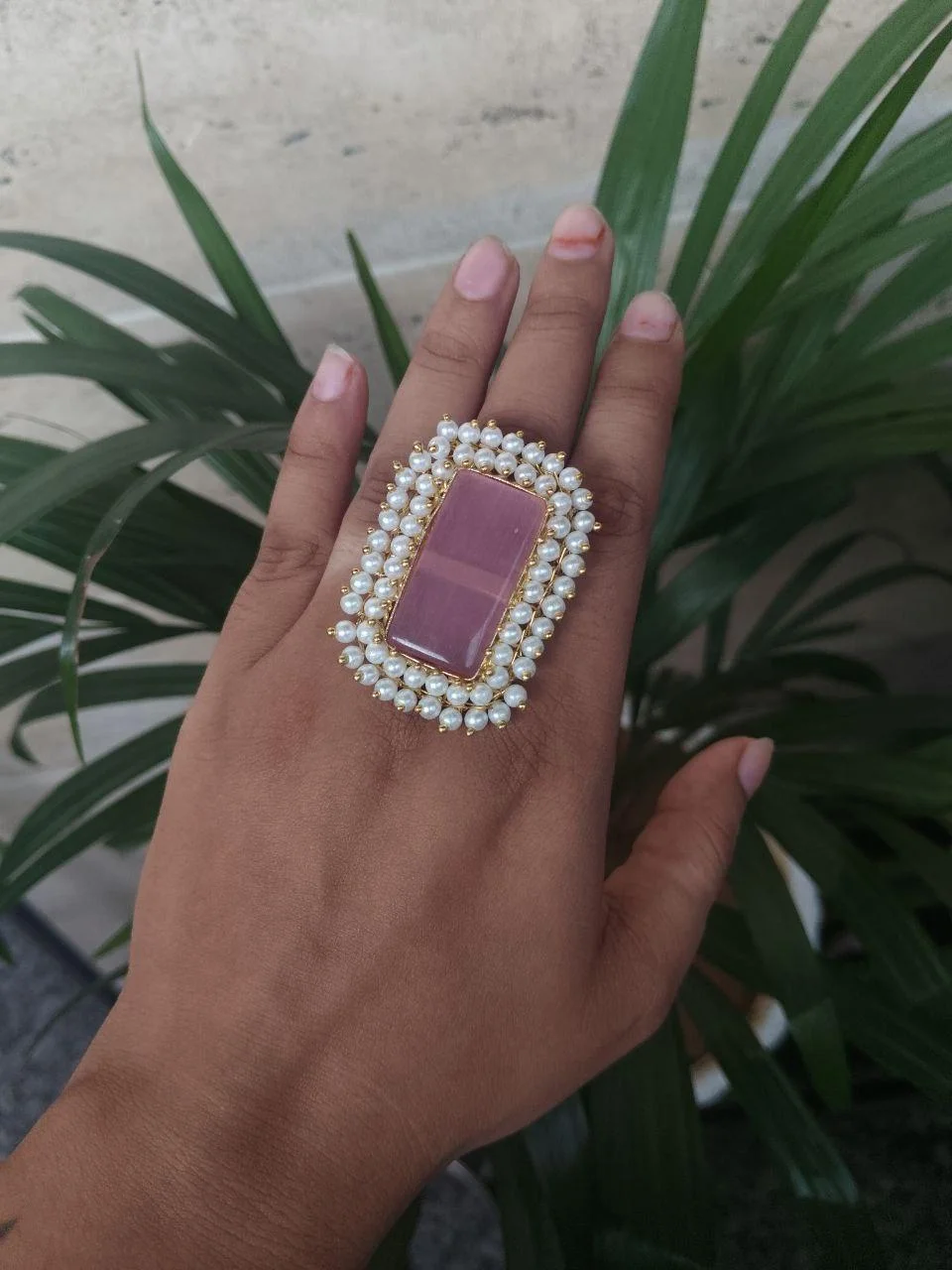 Gold Ring with Purple Stone and Double Pearl Border