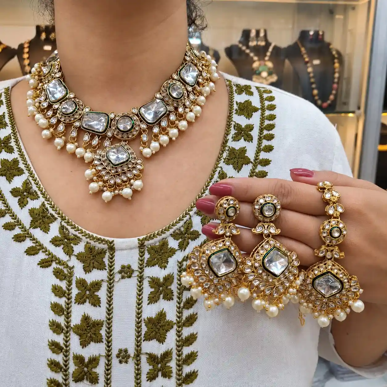 Regal Gold-Plated Kundan Bridal Necklace Set with Green Meenakari, Pearl Drops, Earrings & Maang Tikka – view 2